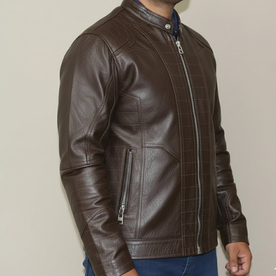 Close‑up of zipper and stitching detail on brown leather jacket