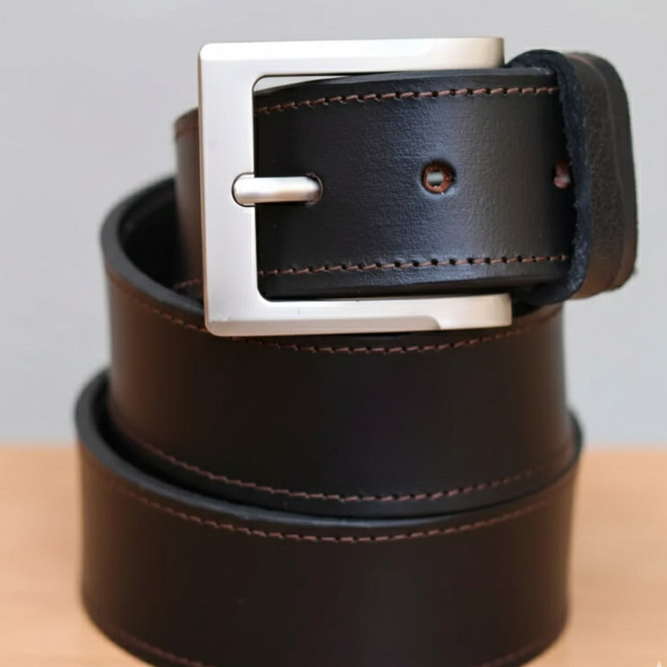 Wide leather belt with strong metal buckle