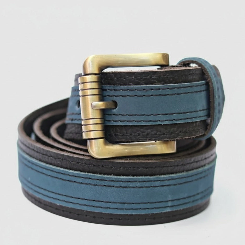 Close-up of blue and black leather belt with metal buckle